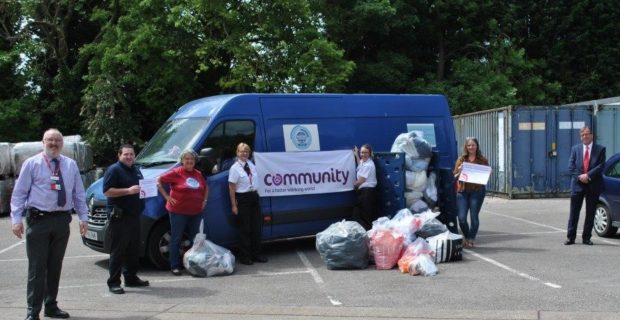 Photo of Lowdham Grange members handing over clothing to the Sharewear team