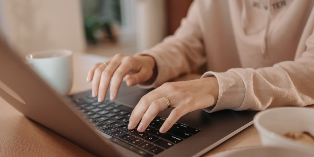 A Community Trade Union Rep typing a digital newsletter