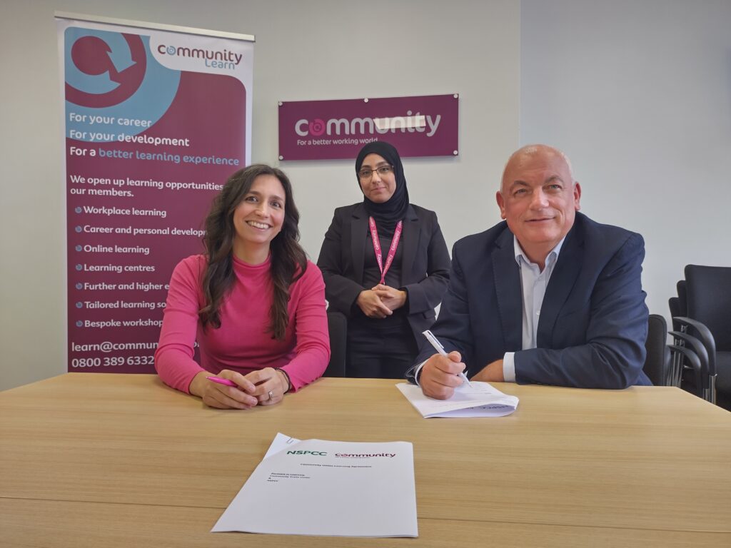 Community Trade Union staff and NSPCC staff signing a Union Learning Agreement.