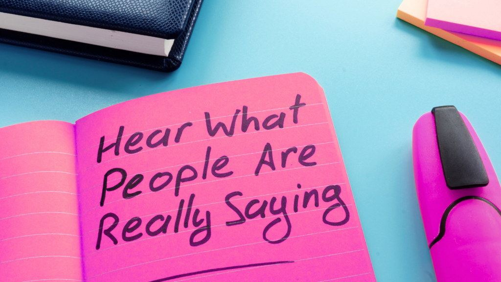 A photograph of a notepad that reads "Hear what people are really saying" in relation to union workplace mapping.