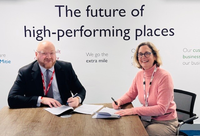 Photograph of Community National Secretary for Justice, Gavin Miller and Mitie Mobilisation Director, Harriet Hancock signing a recognition agreement at Campsfield IRC.